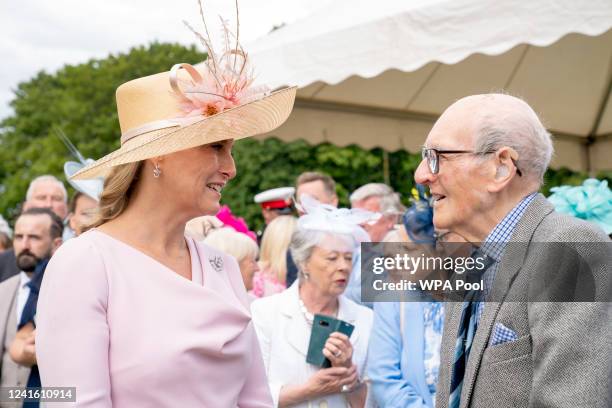 Sophie, Countess of Wessex, known as the Countess of Forfar while in Scotland meets 100-year-old David Flucker during a garden party at the Palace of...