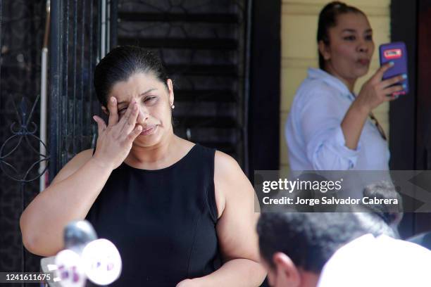 Karen Italia Caballero mother of Alejandro and Fernando Caballero cries before speaking to the media outside their home on June 29, 2022 in Las...