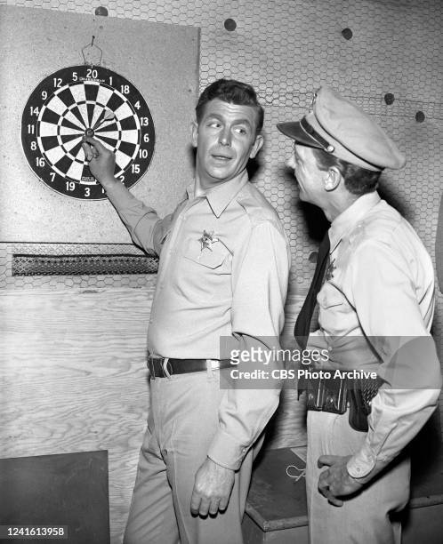 The Andy Griffith Show" on the CBS television network starring From Left: Andy Griffith as Sherriff Andy Taylor and Don Knotts as Deputy Barney Fife...