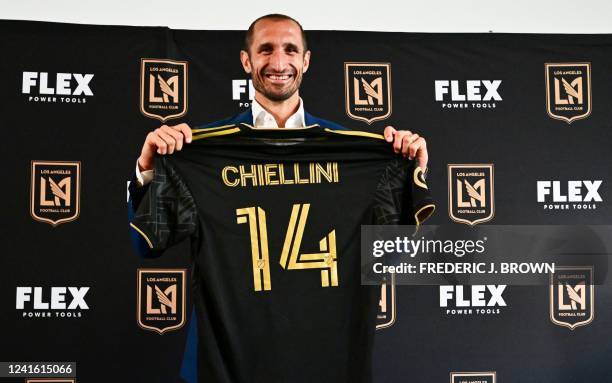 Giorgio Chiellini poses with his jersey at a press conference introducing his arrival to Major League Soccer club Los Angeles FC on June 29, 2022 in...