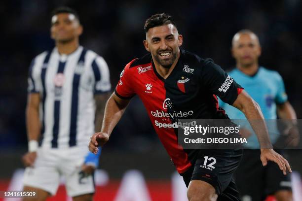 Colon de Santa Fe's Ramon Abila celebrates with teammates after scoring against Talleres de Cordoba during their Copa Libertadores football...