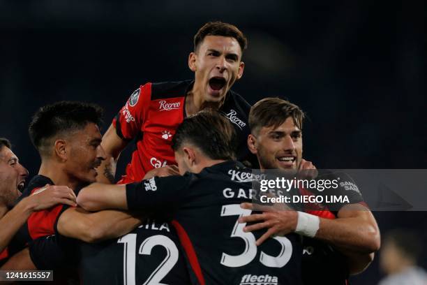 Colon de Santa Fe's Ramon Abila celebrates with teammates after scoring against Talleres de Cordoba during their Copa Libertadores football...