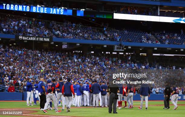 The dugouts clear after Alejandro Kirk of the Toronto Blue Jays was hit by a pitch in the third inning during an MLB game between the Boston Red Sox...