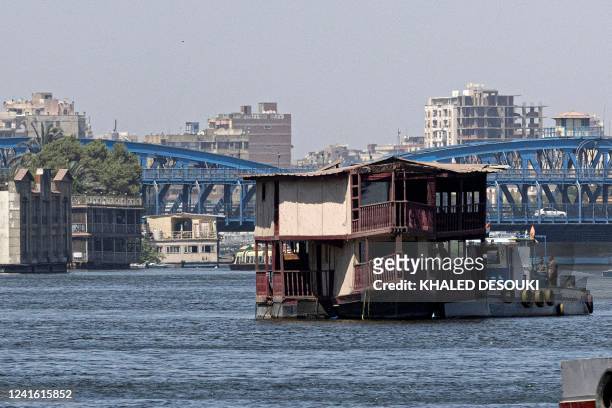 One of the houseboats usually moored across one of the banks of the Nile river between the Zamalek district of Egypt's capital Cairo and the Imbaba...