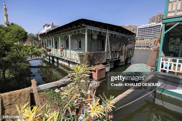 This picture taken on June 27, 2022 from the Giza side of the Nile river shows houseboats moored along the Giza bank in the Agouza district, days...