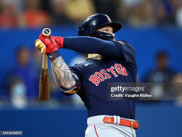Alex Verdugo of the Boston Red Sox hits a two-run home run in the sixth inning during an MLB game against the Toronto Blue Jays at Rogers Centre on...