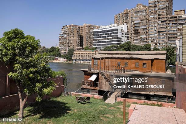 This picture taken on June 27, 2022 from the Giza side of the Nile river shows one of the houseboats moored along the Giza bank in the Agouza...