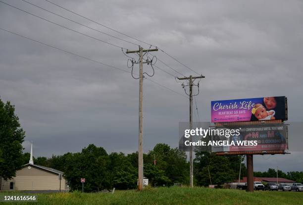 Billboard reading "Cherish Life Heartbeat 18 Days" is seen outside of Carbondale, Illinois, on June 26, 2022. - Abortion is now banned in Missouri....