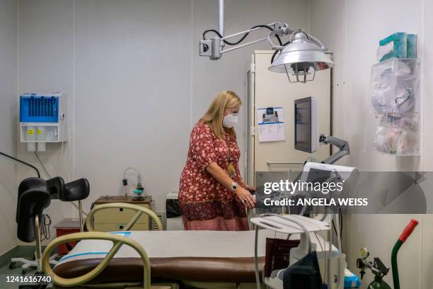 Julie Burkhart, co-owner of the Hope Clinic For Women, looks at an ultrasound machine inside an exam room in Granite City, Illinois, on June 27,...