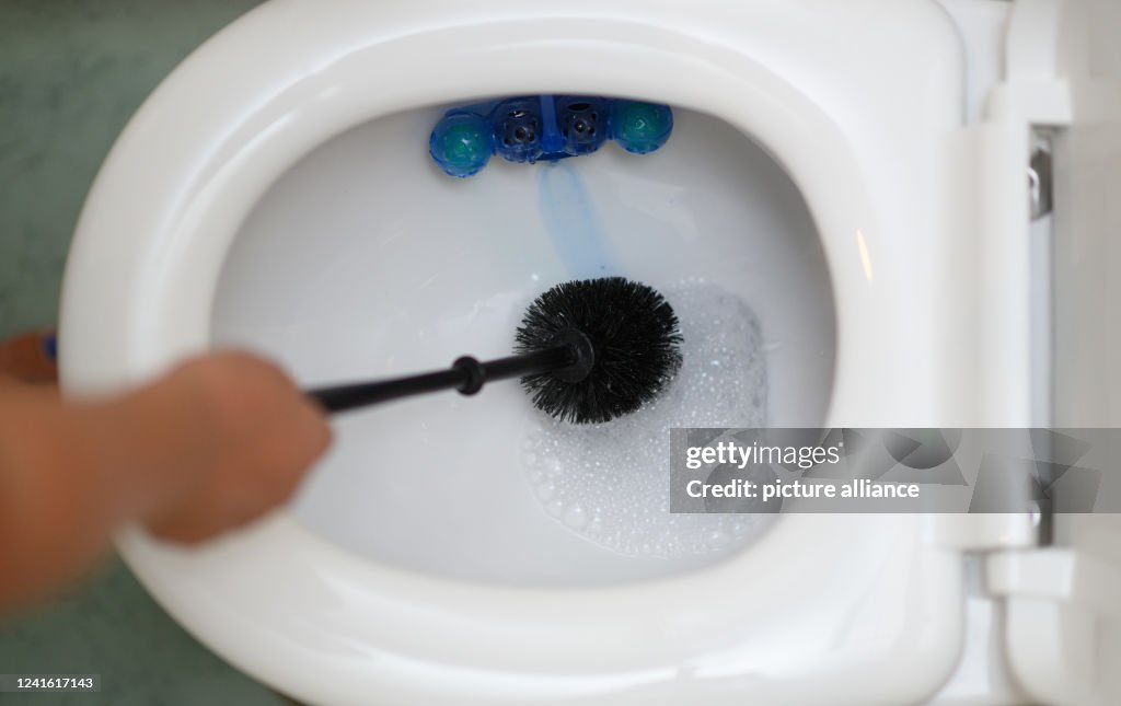With smartphone on the toilet