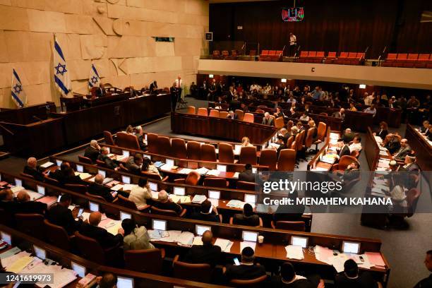 This picture shows a general view of the Israeli Knesset during a meeting, in Jerusalem on June 30, 2022. - Israeli lawmakers dissolved parliament...