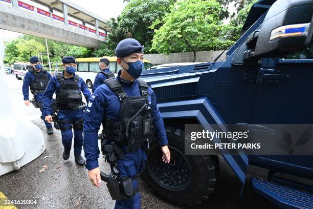 Special unit of the Hong Kong police provides security in the city's Wanchai district on June 30 as Chinese President Xi Jinping arrives in Hong Kong...