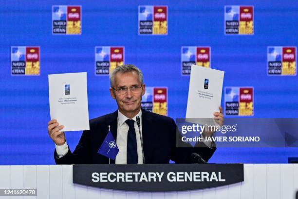 Secretary General Jens Stoltenberg presents the signed documents during the signing ceremony of the NATO Innovation Fund letter of commitment of the...