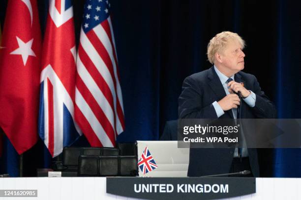 Prime Minister Boris Johnson attends a signing ceremony of the NATO Innovation Fund with other world leaders during the Nato summit in Madrid, on...