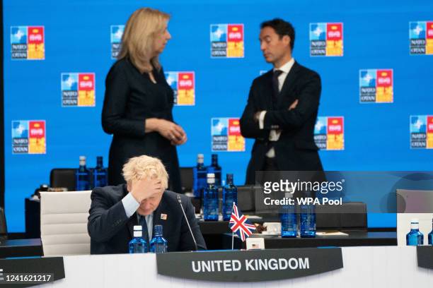Prime Minister Boris Johnson attends a meeting of the North Atlantic Council with other NATO members during the Nato summit in Madrid, on June 30,...