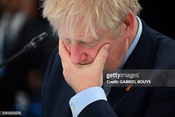 Britain's Prime Minister Boris Johnson gestures ahead of a meeting of The North Atlantic Council during the NATO summit at the Ifema congress centre...