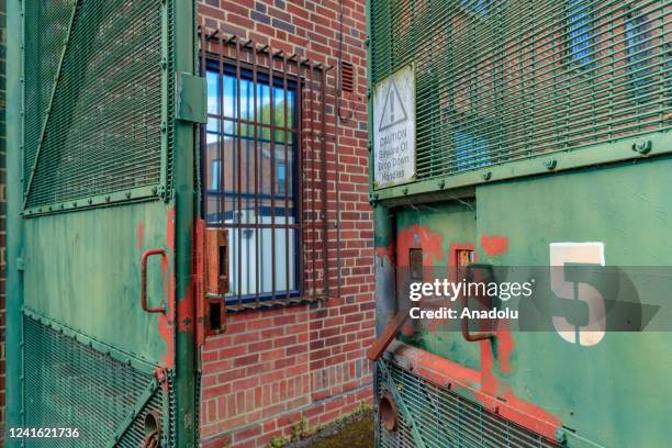 General picture shows an iron-wired window that is believed to be the prison cell in the abandoned facility inside the Immigration Removal Centre...