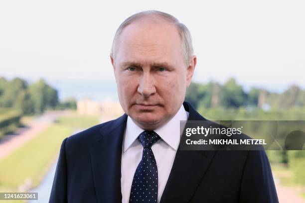 Russian President Vladimir Putin delivers a video address to participants of the 10th Saint Petersburg International Legal Forum in Saint Petersburg...