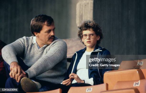Athlete Zola Budd chats with coach Peter Labaschagne during a Track meeting circa 1985 in London, United Kingdom.
