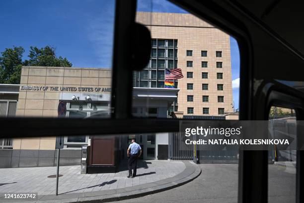 National and rainbow flags fly in front of the US embassy in Moscow on June 30, 2022. Moscow officials changed the official address of the US embassy...