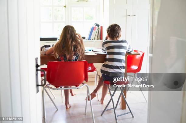 twin brother and sister home schooling - homework table stock pictures, royalty-free photos & images