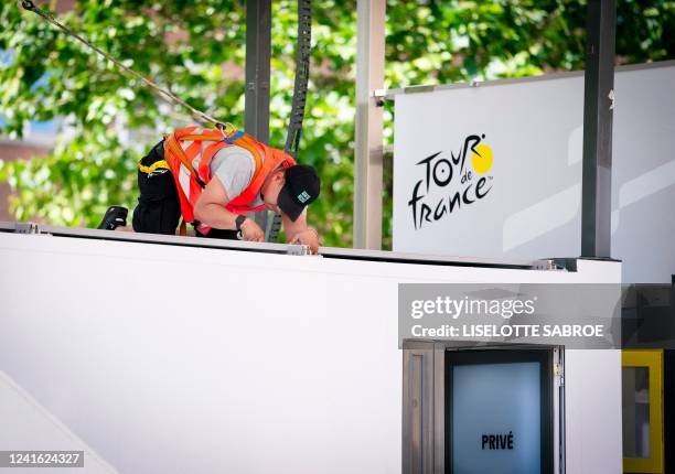 Worker installs the starting area for the individual time trial competition at Noerre Farimagsgade in Copenhagen, Denmark, on June 30 a day ahead of...
