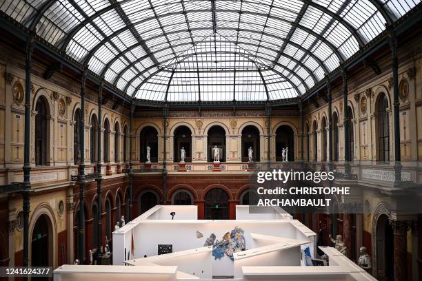 This picture shows an overview of the glass-roofed courtyard of the Ecole Nationale Superieure des Beaux-Arts where students's artworks are displayed...