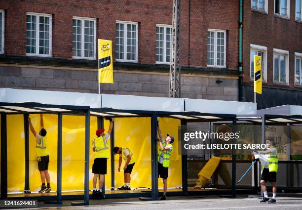 Helpers install the starting area for the individual time trial competition at Noerre Farimagsgade in Copenhagen, Denmark, on June 30 a day ahead of...