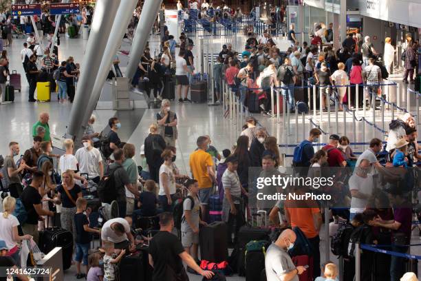 Passengers are seen at Duesseldorf airport in Duesseldorf, Germany on June 30, 2022 as governments plans to rescue chaos to bring more foreign...