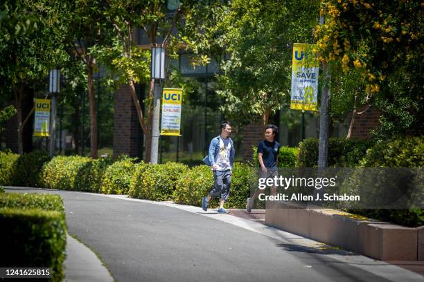Pedestrians walk through campus at UCI, Irvine, CA on Wednesday, June 29, 2022. Former UCI student, Sebastian Dumbrava, who over the past two years...