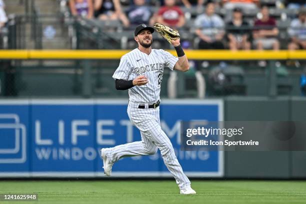 Colorado Rockies left fielder Kris Bryant catches a fly ball during a game between the Los Angeles Dodgers and the Colorado Rockies at Coors Field on...