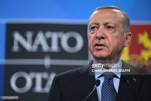 Turkey's President Recep Tayyip Erdogan addresses media representatives during a press conference at the NATO summit at the Ifema congress centre in...