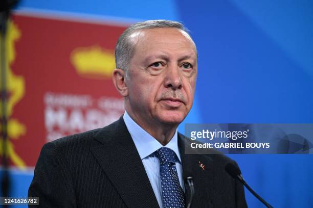 Turkey's President Recep Tayyip Erdogan addresses media representatives during a press conference at the NATO summit at the Ifema congress centre in...