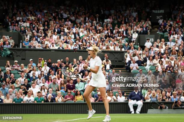 Britain's Katie Boulter celebrates winning a point against Czech Republic's Karolina Pliskova during their women's singles tennis match on the fourth...
