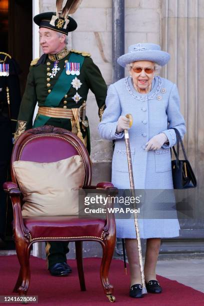 The Duke of Buccleuch and Queen Elizabeth II attending the Queen's Body Guard for Scotland Reddendo Parade in the gardens of the Palace of...