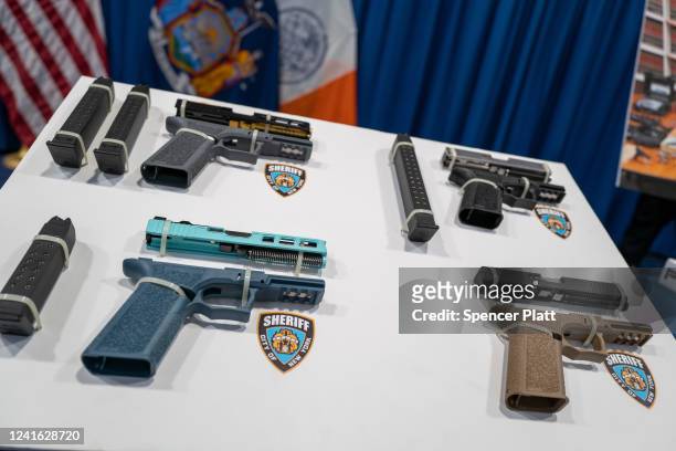 Confiscated "ghost guns" are displayed before a news conference with New York Mayor Eric Adams and Attorney General Letitia James and others to...