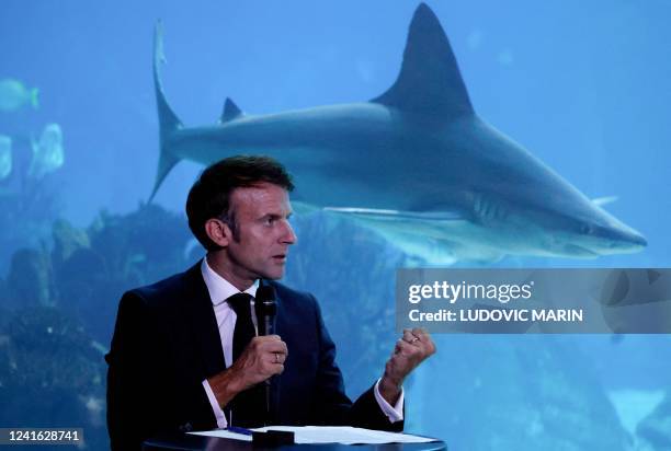 France's President Emmanuel Macron speaks during a round table with oceans' speacialists at the Lisbon Oceanarium, in Lisbon on June 30 as part of...
