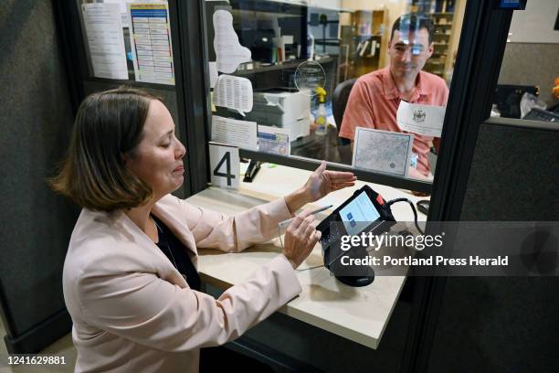 Secretary of state Shenna Bellows demonstrates how Mainers are now electronically registering to vote or updating voter registration at BMV locations...