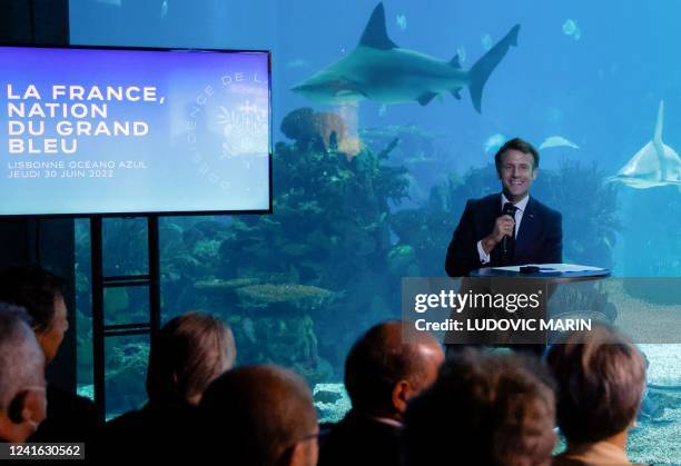 France's President Emmanuel Macron speaks during a round table with oceans' speacialists at the Lisbon Oceanarium, in Lisbon on June 30 as part of...