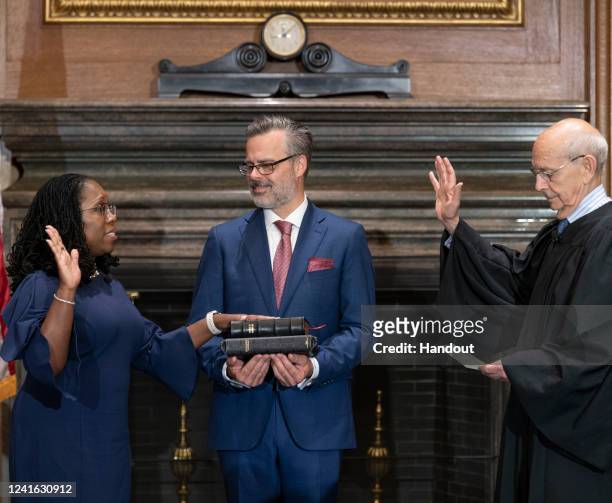 In this handout provided by the Supreme Court, Justice Stephen G. Breyer administers the Judicial Oath to Judge Ketanji Brown Jackson in the West...