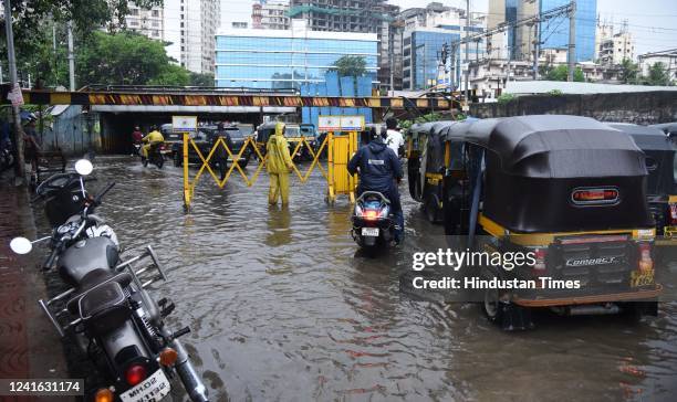 Vehicles wade through waterlogged Andheri Subway due to heavy rain at Andheri, on June 30, 2022 in Mumbai, India.