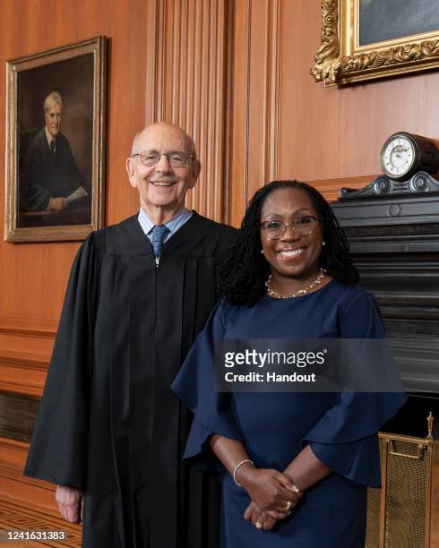 In this handout provided by the Supreme Court, Justice Stephen G. Breyer and Justice Ketanji Brown Jackson pose for a portrait together on June 30,...