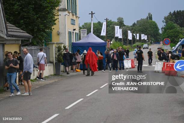 French gendarmes secure the access to the Eurockeennes rock music festival after the cancellation, in Belfort, eastern France, on June 30, 2022. -...