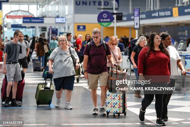 Travelers arrive at O'Hare International Airport on June 30, 2022 in Chicago, Illinois. - Based on projections from airline carriers Chicago's...