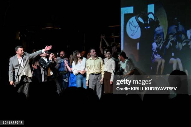 Gogol Centre artistic director Alexey Agranovich gives a speech on stage after a performance in Moscow on June 30, 2022. - Moscow authorities...