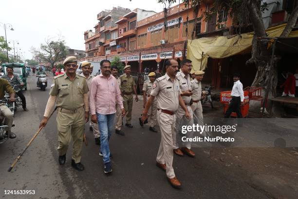 Police personnel during a 'bandh' called by various Hindu organisations to protest against the murder of tailor Kanhaiya Lal in Udaipur, in...