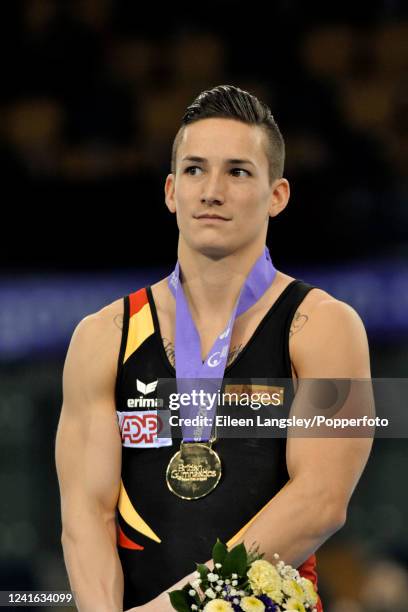 Gold medalist Marcel Nguyen of Germany on the podium after winning the men's all-round competition during the FIG Artistic Gymnastics Glasgow World...