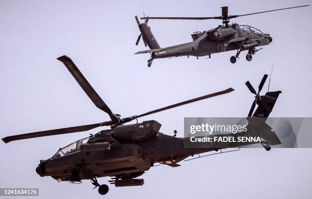 Army AH-64 Apache attack helicopters fly over during the second annual "African Lion" military exercise in the Tan-Tan region in southwestern Morocco...