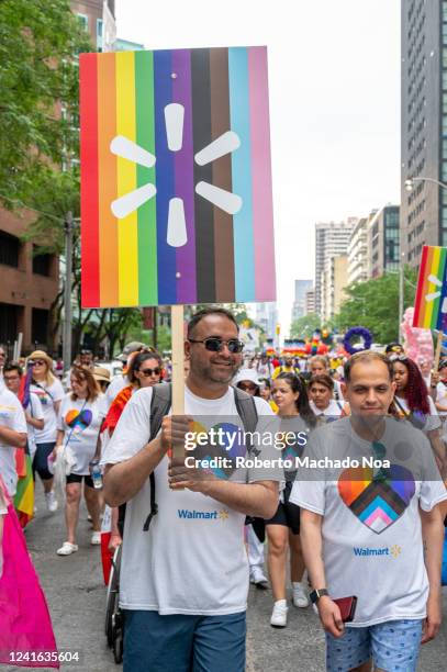 Group of people belonging to Walmart marches during Pride Parade.