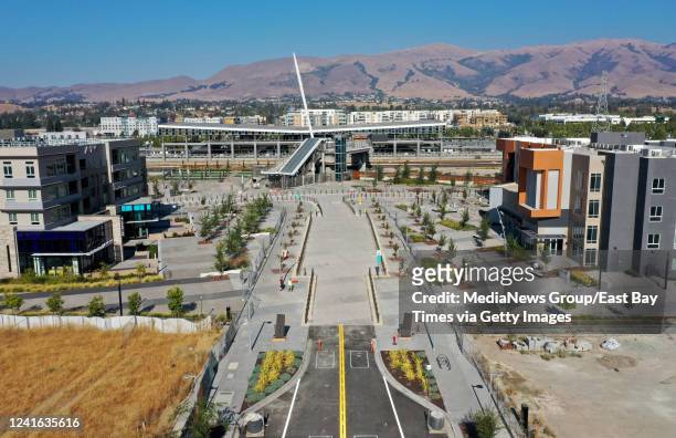 The Aya Apartments, Warm Springs BART West Access Bridge and the Innovia Apartments, from left, are seen from this drone view in Fremont, Calif., on...